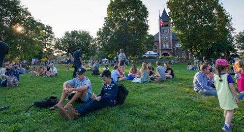 people sitting on t-hall lawn