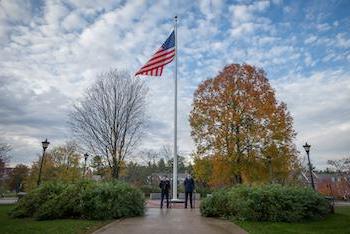 American flag and ROTC students