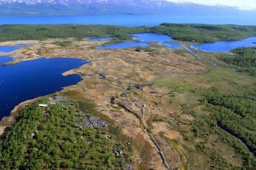 Aerial image of Abisko, Sweden, with lakes and green land near mountains.